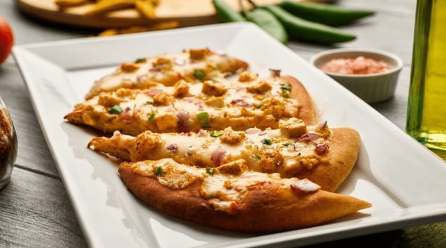 Shahi Paneer Naan Pizza.